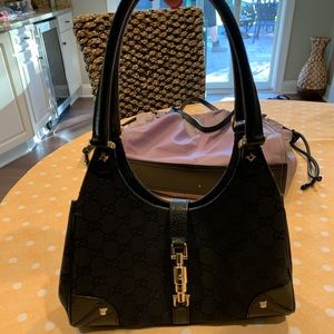 Gucci black and gold clasp bag